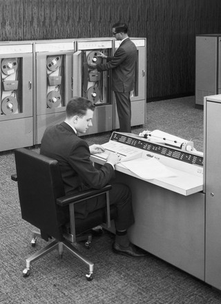 Two Men Working with Early Mainframe Computer, 1955
